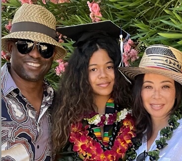 Wayne Brady with his wife and their daughter.